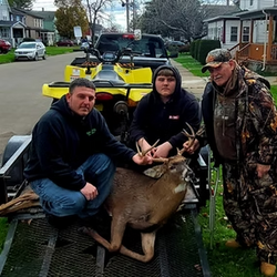 hunters with white tailed deer